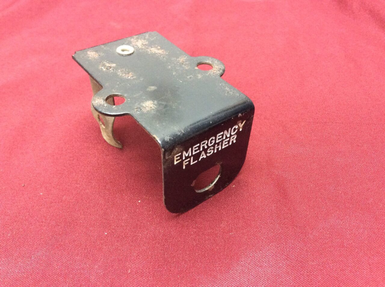 emergency flasher switch mounting bracket with imprint